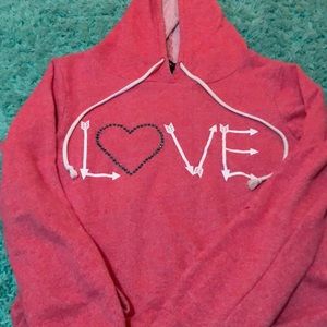 This is a pink long sleeve crop top